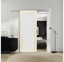 Aménagement de pièce avec porte coulissante, commode, tapis et vue sur la chambre