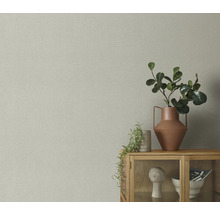 Gros plan d'un mur avec du papier peint textile aspect toile