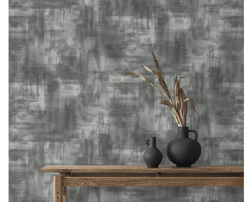 Papier peint décoratif avec motif abstrait en gris et blanc.