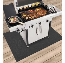 Barbecue avec des aliments sur un tapis de barbecue