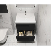 Salle de bain moderne avec meuble sous-vasque, tiroir ouvert et carrelage en marbre