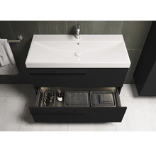 Meuble-lavabo avec tiroir ouvert, lavabo, robinet et serviette