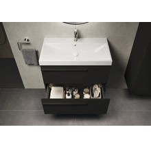 Meuble sous-lavabo avec tiroir ouvert dans une salle de bain