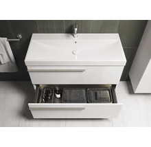 Meuble sous-lavabo blanc avec tiroir ouvert pour accessoires de salle de bain