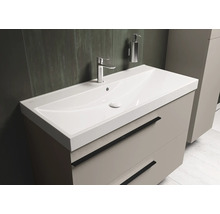 Meuble-lavabo avec lavabo, robinetterie et meuble bas à tiroirs pour la salle de bain.