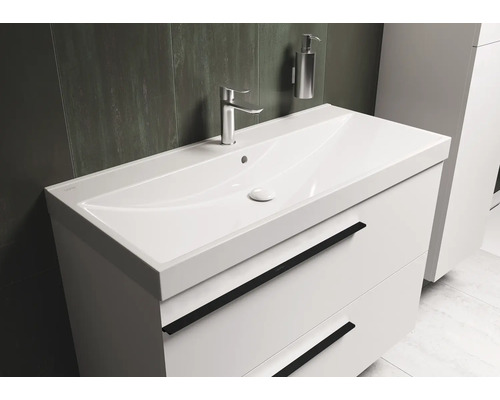 Meuble-lavabo blanc avec deux tiroirs, robinet et distributeur de savon