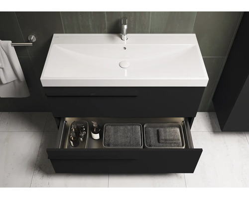 Meuble-lavabo avec tiroir ouvert dans une salle de bains