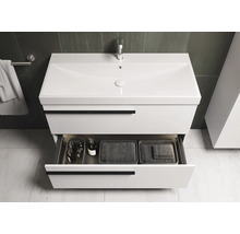 Meuble sous-lavabo avec tiroir ouvert dans une salle de bains