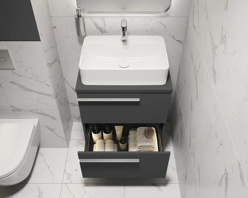 Modernes Badezimmer mit Waschbeckenunterschrank, Aufsatzwaschbecken und geöffneter Schublade