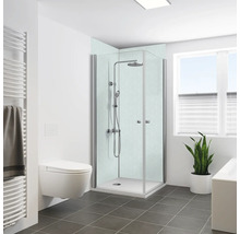 Salle de bains lumineuse avec douche, toilettes, radiateur et plante