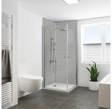 Salle de bains avec douche d'angle, toilettes et radiateur