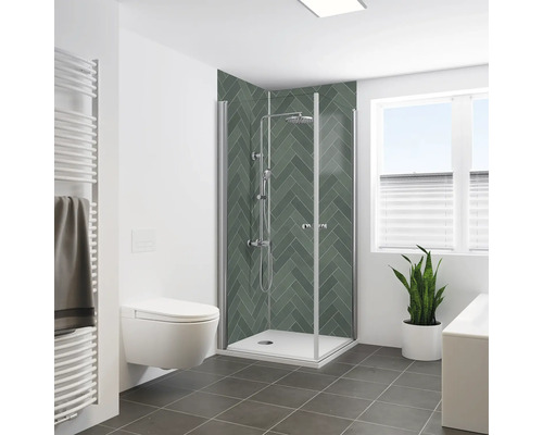 Panneau mural de douche BREUER chevrons mat satiné grün 255 x 100 cm 9482579000203 Salle de bain avec douche, toilettes, sèche-serviettes, plante et fenêtre pour une ambiance lumineuse et organisée.