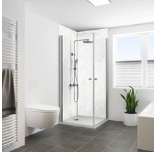 Salle de bains moderne avec cabine de douche, toilettes, radiateur et fenêtre