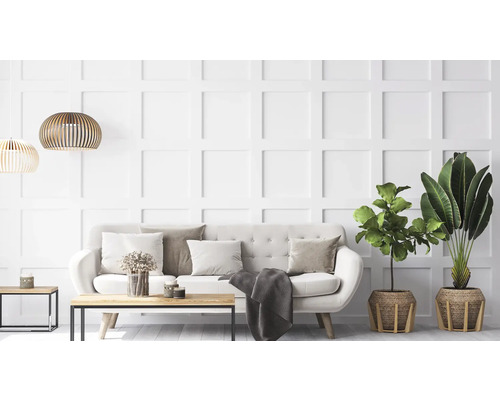 Salon lumineux avec canapé, table et plantes d'intérieur