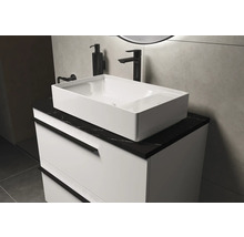 Meuble-lavabo avec vasque à poser blanche et plan de travail noir