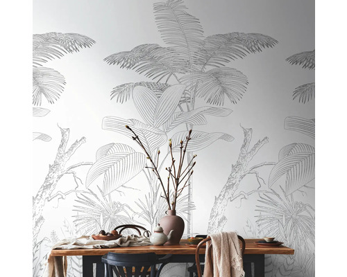 Salle à manger avec table et papier peint jungle à motifs végétaux