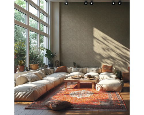Salon lumineux avec grande baie vitrée, canapé d'angle, tapis et table en bois