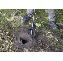 Perceuse dans le sol pour creuser un trou