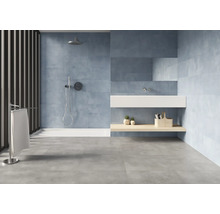 Salle de bain moderne avec douche, lavabo et carrelage gris.