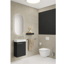 Modernes Badezimmer mit Waschtisch, Spiegel, Toilette und Ablage