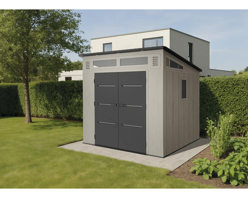 Abri de jardin avec double porte et fenêtre dans le jardin