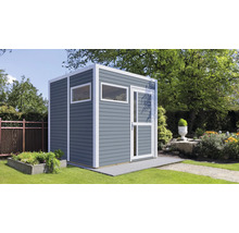 Abri de jardin avec fenêtre et porte dans le jardin