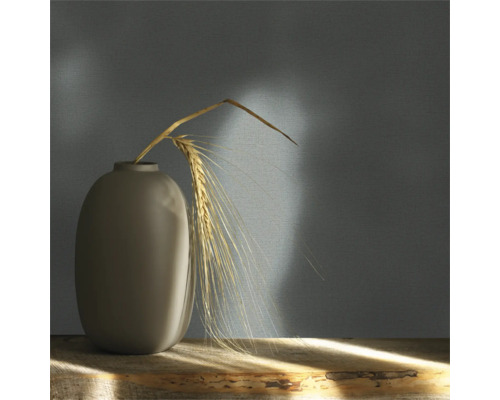 Vase décorative avec épi de blé sur une table en bois