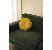 Rundes Dekokissen auf einem Sofa