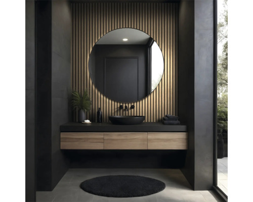 Salle de bains moderne avec miroir rond, meuble sous-lavabo et tapis foncé