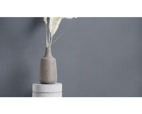 Vase décorative avec plantes sur socle