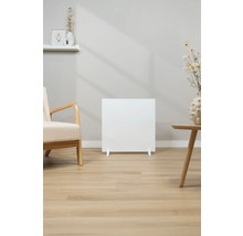 Radiateur blanc dans salon avec fauteuil et table