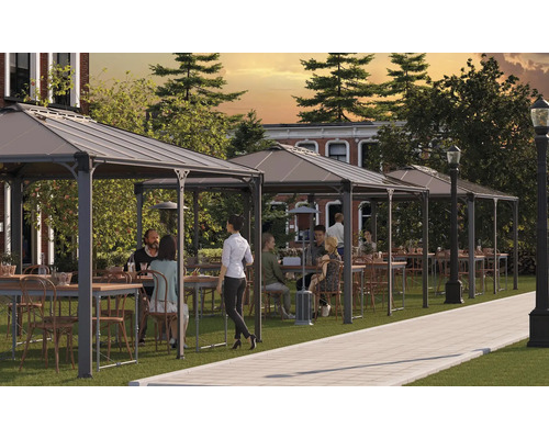 Plusieurs pavillons avec tables et chaises sur une pelouse pour l'extérieur.