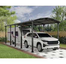 Aire de stationnement couverte avec voiture et caravane à l'extérieur