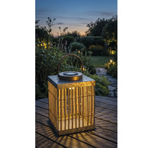 Lanterne solaire décorative en métal et bambou dans le jardin