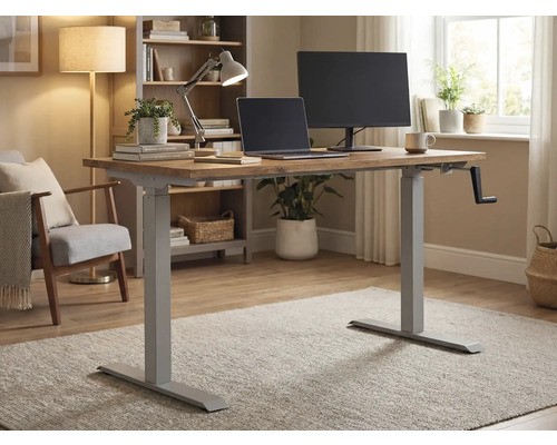 Bureau réglable en hauteur avec manivelle, ordinateur portable et moniteur dans une pièce lumineuse.