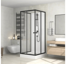 Salle de bain avec cabine de douche, lavabo, miroir et toilettes dans un design lumineux