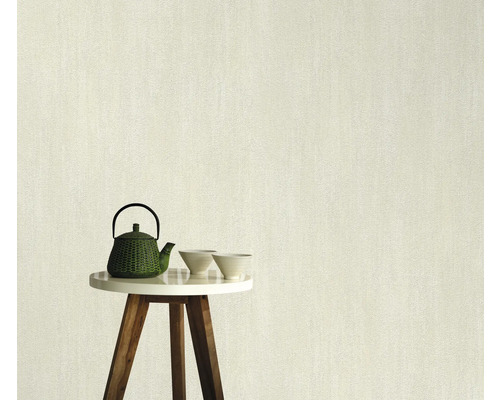 Papier peint intissé clair avec une texture fine sur une table avec une théière et des bols