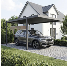 Abri de voiture avec voiture devant une maison.