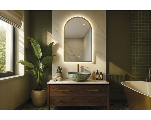 Badezimmer mit Waschtisch, Spiegel und Pflanze für ein helles und geräumiges Ambiente.