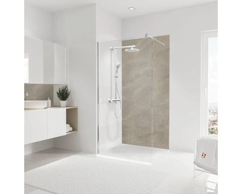 Salle de bains avec paroi de douche en verre, meuble sous-lavabo et serviette