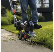 Coupe-bordures en cours d'utilisation pour tailler les bordures de pelouse