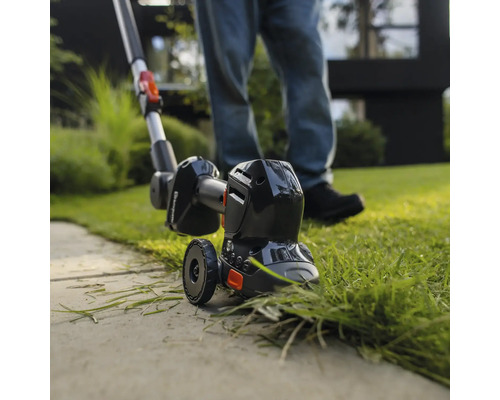 Coupe-bordures en cours d'utilisation pour tailler les bordures de pelouse