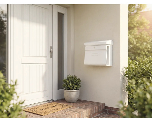 Espace d'entrée avec porte d'entrée, boîte aux lettres et paillasson