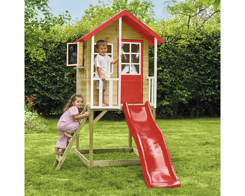 Maisonnette pour enfants avec toboggan et échelle dans le jardin