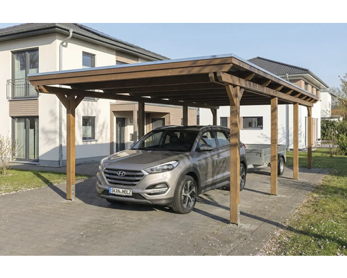 Carport en bois avec voiture et remorque sur un sol pavé