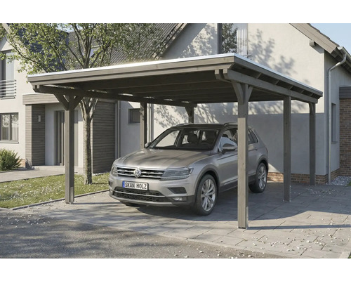 Ein Carport aus Holz mit einem Auto darunter, das auf einem gepflasterten Weg steht.