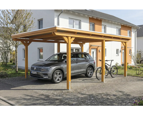 Abri de voiture en bois avec voiture et vélo