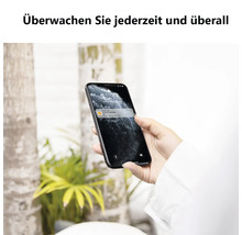 Smartphone avec une notification d'une application de maison connectée pour surveiller un thermostat sans fil à distance.