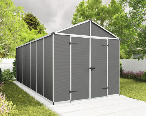 Abri de jardin moderne en métal avec toit à deux versants et double porte anthracite sur une fondation dans un jardin.