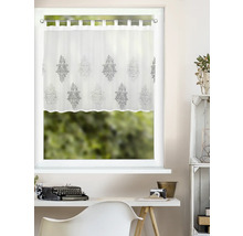 Brise-bise blanc à pattes avec motif d'ornement gris sur une fenêtre au-dessus d'un bureau clair.